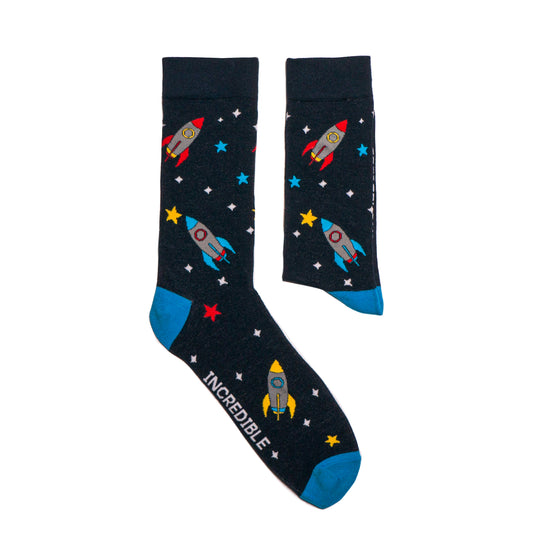 Socks that inspire us to remember those space exploration posters on our bedroom walls and and the days spent dreaming of blasting off to meet aliens from far off planets. Rocket-ships, stars, and, planets. Treat your feet to an out of this world experience.  Soft. Strong. Comfortable. Sustainable. Available in US Men’s 4-8 and 8-12