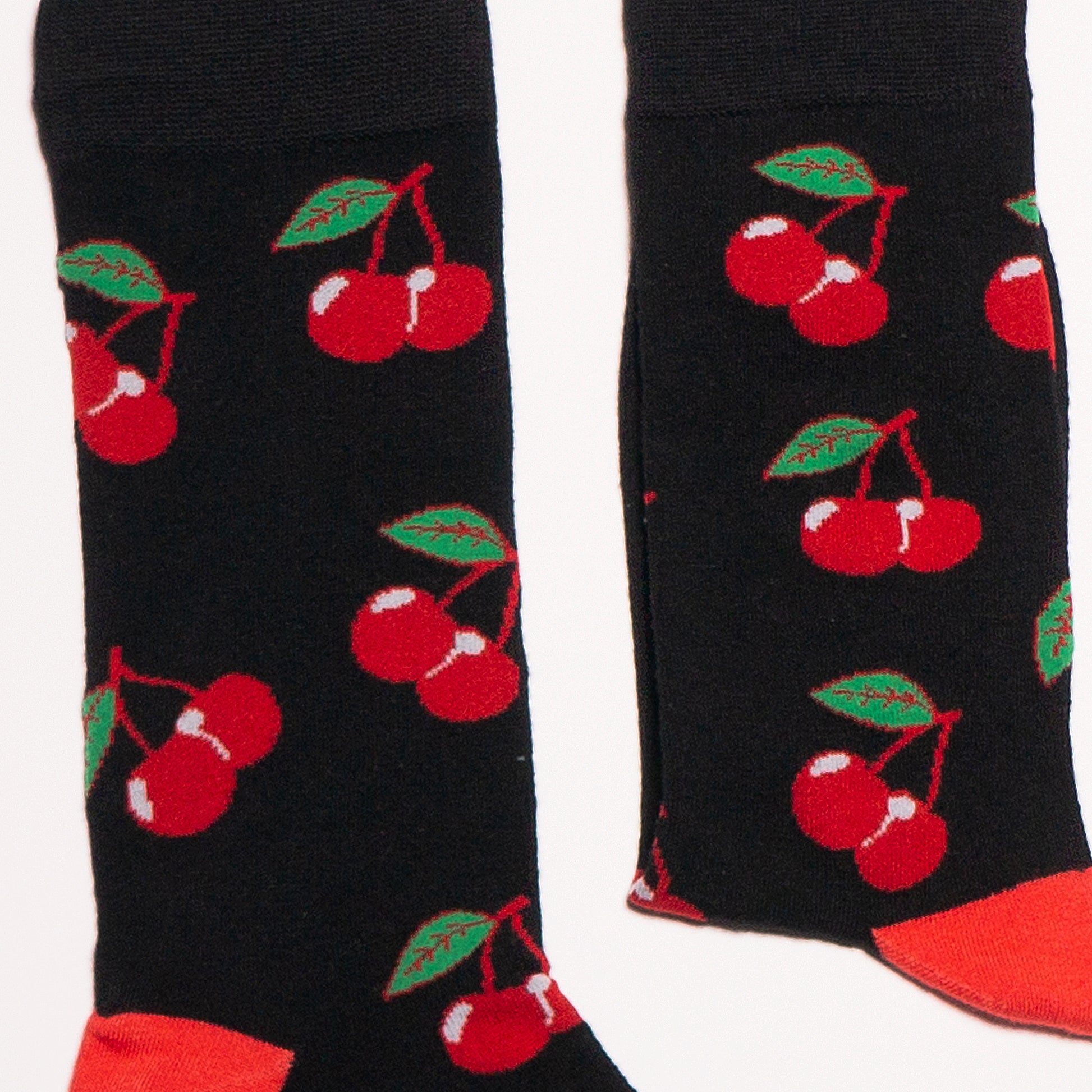 Cherry Socks! Fruity. One in a series of five pairs of socks each representing your favorite fruits. Buy individually or as part of your 5-A DAY! Buy 4 in the collection and get your 5th fruity pair for FREE! Who doesn't love cherries! The 5-A-DAY collection consists of Banana-rama, Strawberry Surprise, Cherry On Top, Perfect Pineapples and Melon Deliciousness. Available in US Men’s 4-8 and 8-12. Soft. Strong. Sustainable. Comfortable. Incredible Socks.