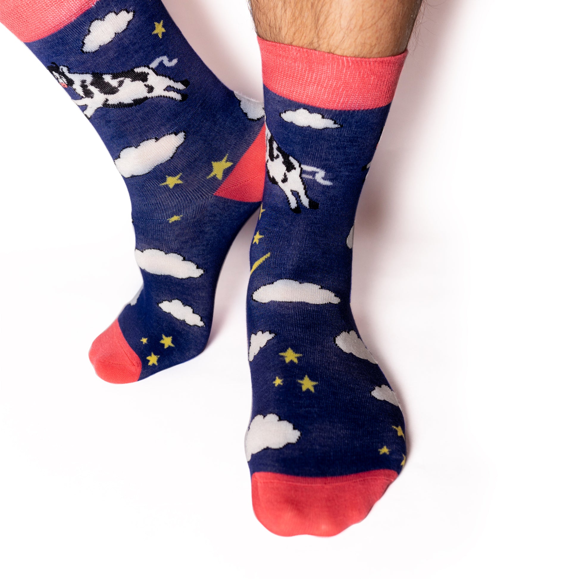 Just like in the nursery rhyme when the cow jumped over the moon. A navy base sets the scene of a fantastical, fun, star-filled night sky. Cows. On Socks. We know! Available in US Men’s 4-8 and 8-12. Soft. Strong. Sustainable. Comfortable. Incredible Socks. Cow jumping over the moon socks.