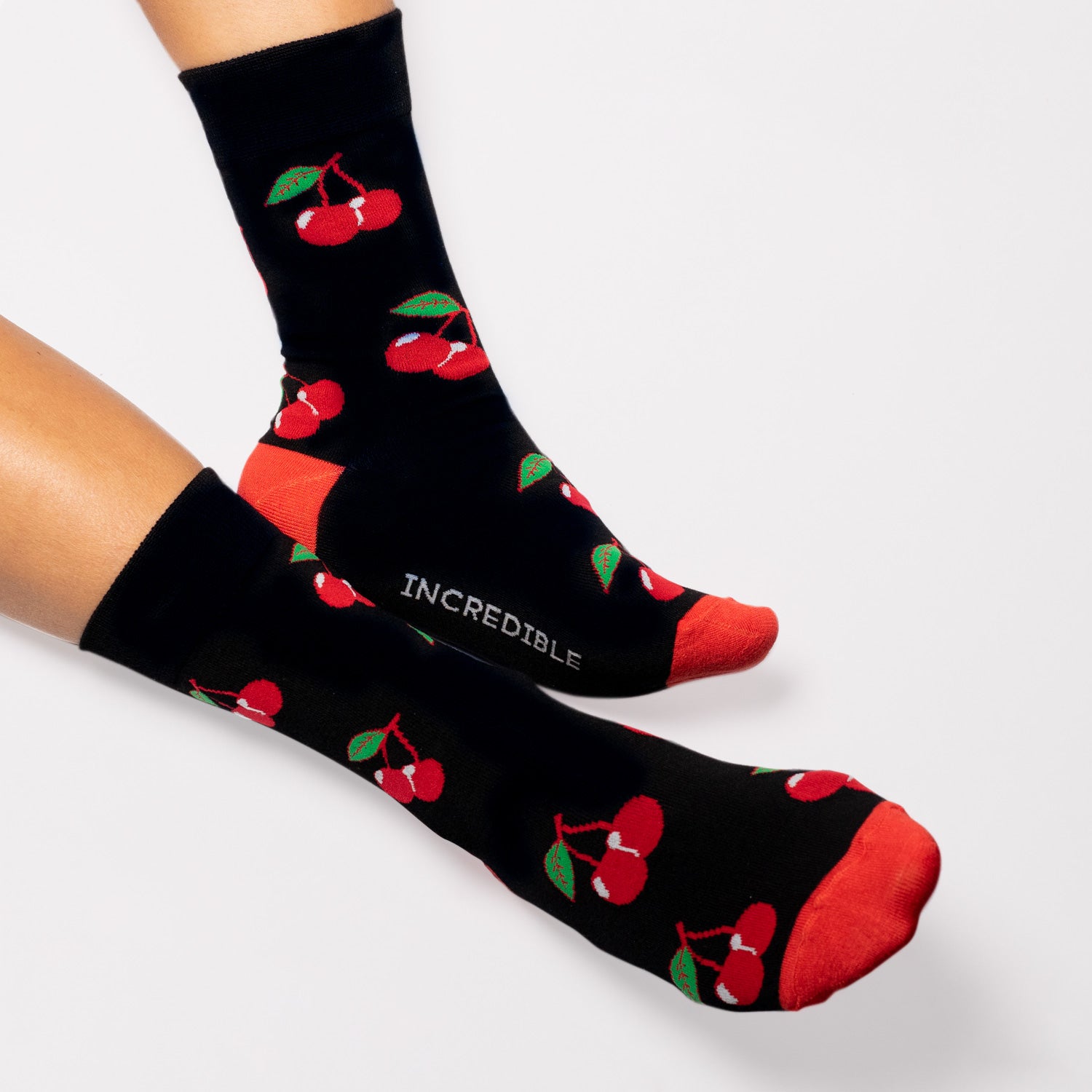 Cherry Socks! Fruity. One in a series of five pairs of socks each representing your favorite fruits. Buy individually or as part of your 5-A DAY! Buy 4 in the collection and get your 5th fruity pair for FREE! Who doesn't love cherries! The 5-A-DAY collection consists of Banana-rama, Strawberry Surprise, Cherry On Top, Perfect Pineapples and Melon Deliciousness. Available in US Men’s 4-8 and 8-12. Soft. Strong. Sustainable. Comfortable. Incredible Socks.