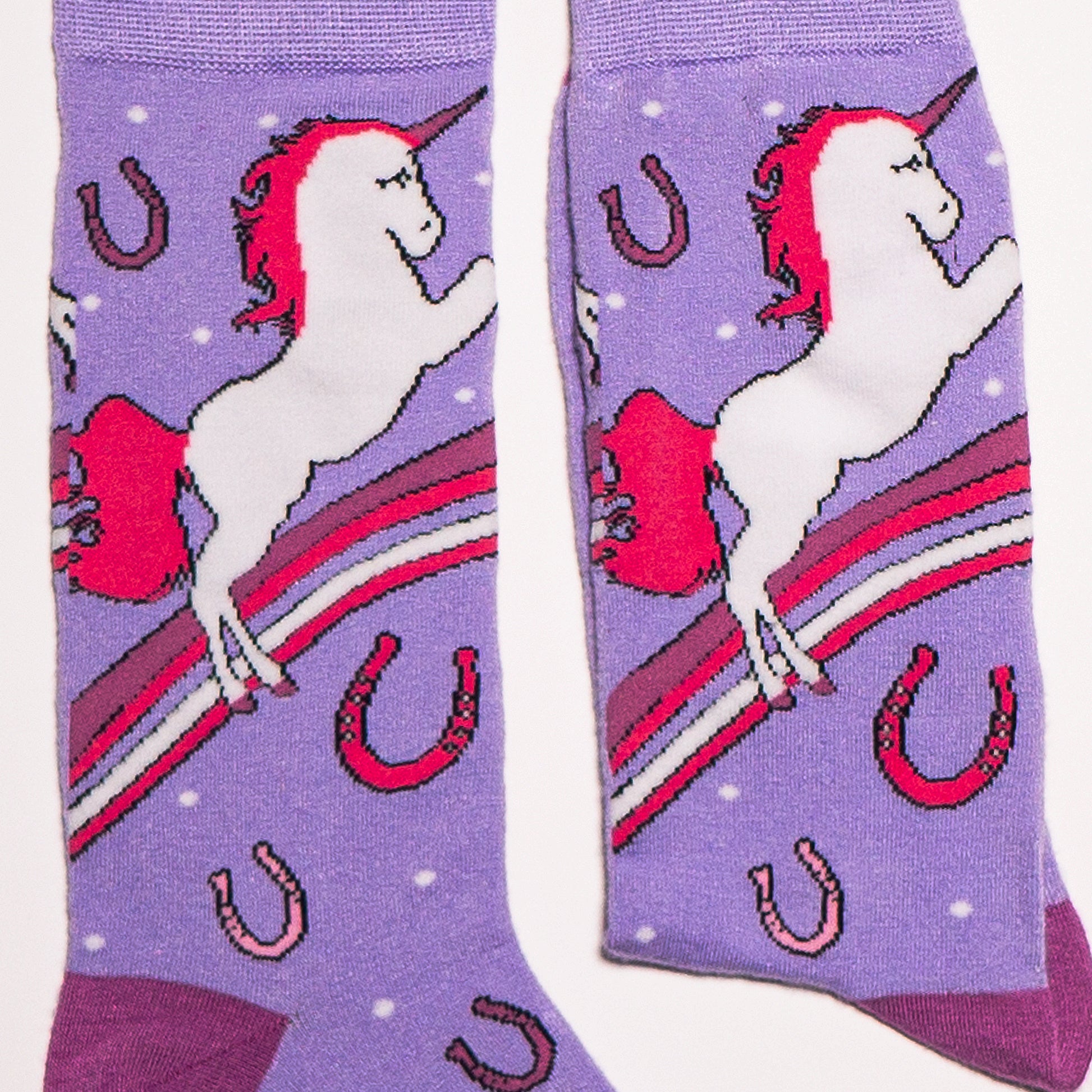 Unicorns, rainbows, horseshoes and fantastical attitude. Perfect shades of pink and purple muddled together make these socks must haves. Soft. Strong. Sustainable. Comfortable.   Available in US Men’s 4-8