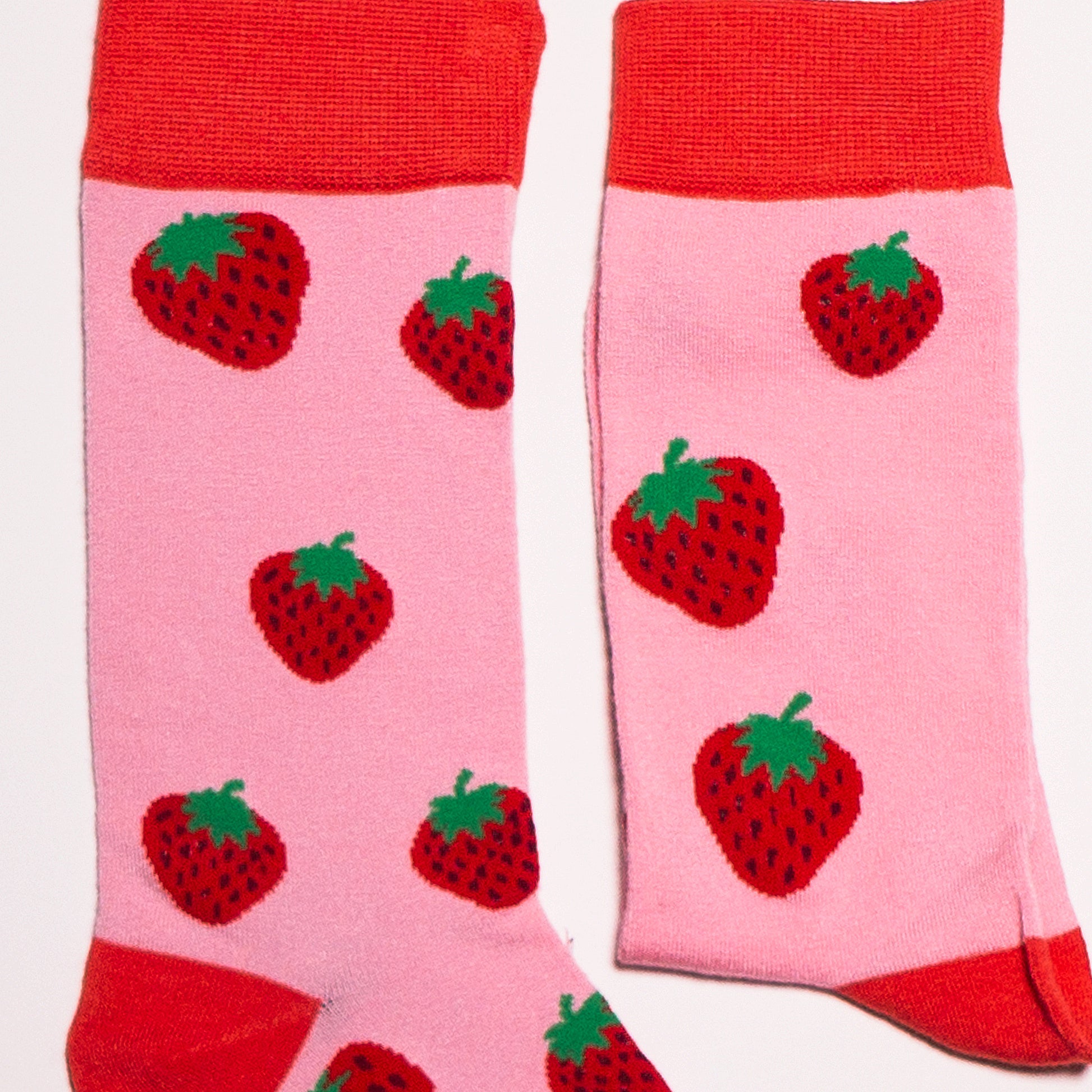 Strawberry Socks! Fruity. One in a series of five pairs of socks each representing your favorite fruits. Buy individually or as part of your 5-A DAY! Buy 4 in the collection and get your 5th fruity pair for FREE! Yum - strawberries.  The 5-A-DAY collection consists of Banana-rama, Strawberry Surprise, Cherry On Top, Perfect Pineapples and Melon Deliciousness. Soft. Strong. Sustainable. Comfortable.   Available in US Men’s 4-8 and 8-12