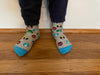 Kids socks on child's feet with colorful superheroes. Spider Man, Captain America, Iron Man, The Hulk. Made from sustainable bamboo.