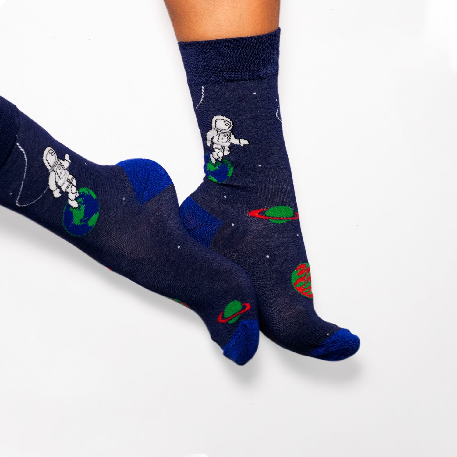 Socks that inspire us to remember those space exploration posters on our bed room walls and days spent dreaming of blasting off to meet aliens from far off planets. Space explorers, planets and tons of adventure awaits.  Soft. Strong. Comfortable. Sustainable. Available in US Men’s 4-8 and 8-12